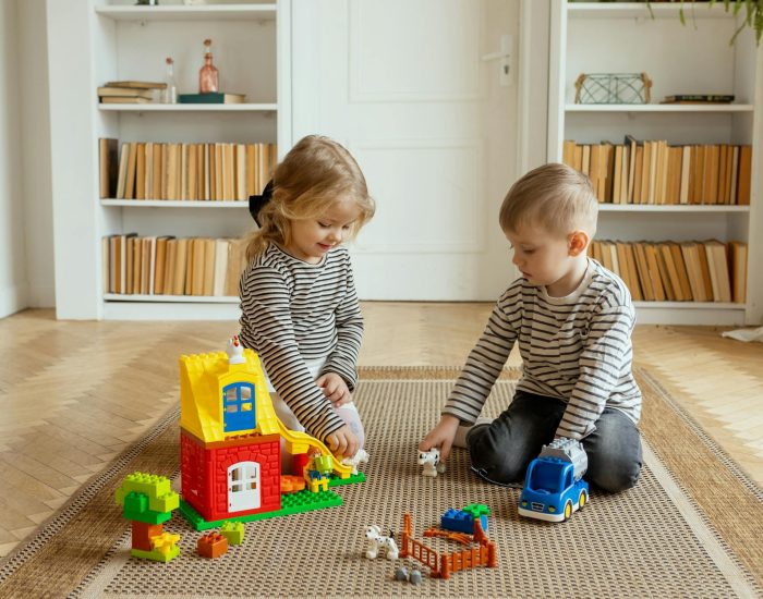 free-photo-of-children-playing-with-toys-in-room